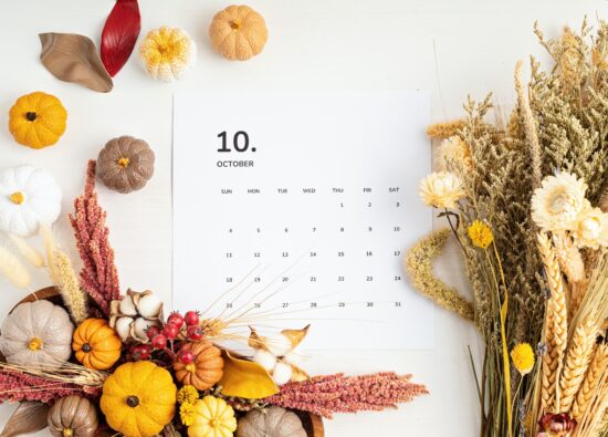 Flat lay with calendar for october with autumn table decoration